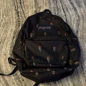 JanSport Black with Red Floral women’s backpack used lightly